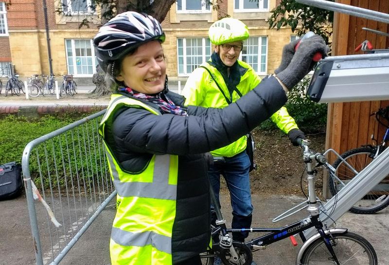 Harriet Waters, Head of Environmental Sustainability, tests the bike racks