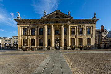 Photo of the front exterior of the Clarendon Building, image set against bright blue sky