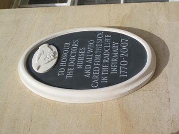 Photo of plaque reading 'To honour the doctors, nurses and all who cared for the sick in the Radcliffe Infirmary 1770-2007', white text on black background