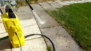 Photo of pavement being cleaned by a turbo lance power washer
