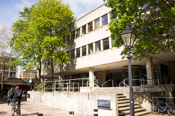 Photo of exterior of the University Offices, Wellington Square, with 2 trees in the foreground